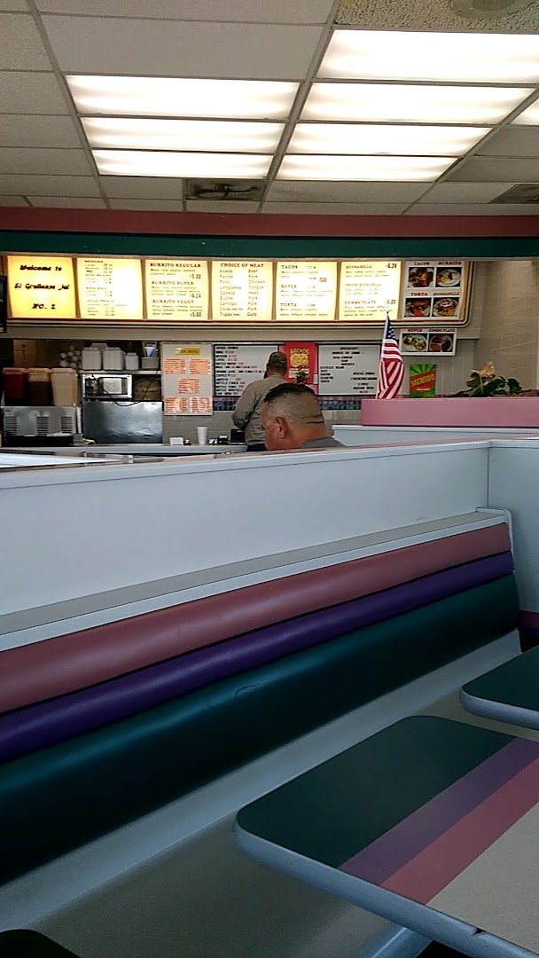 Casual seating inside a fast food restaurant.